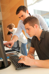 Educator helping student in training class
