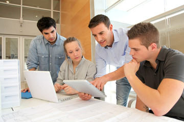 Students in architecture working on electronic tablet