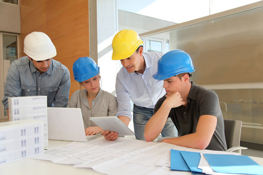 Students in architecture working on electronic tablet