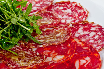 Italian sausage assorted with tomato, cucumber and ruccola