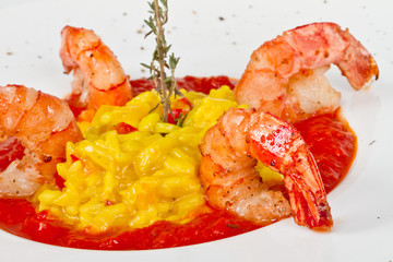 Plate of Shrimps Risotto garnished with fresh parsley and Parmes