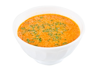 a plate of soup on a white background