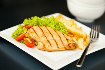 Chicken, French fries and salad