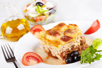 Greek cuisine. Moussaka and greek salad