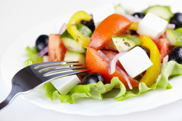 Greek salad on white plate
