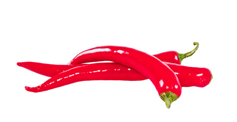 The heap of red hot chili peppers isolated on white background