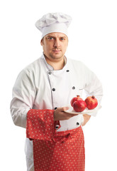 chef in uniform with pomegranates