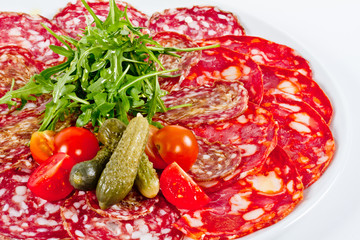 Italian sausage assorted with tomato, cucumber and ruccola