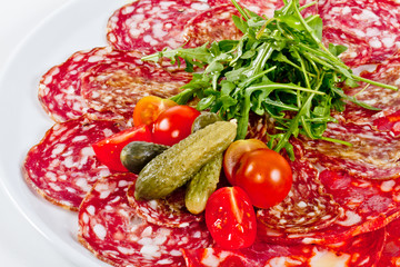 Italian sausage assorted with tomato, cucumber and ruccola