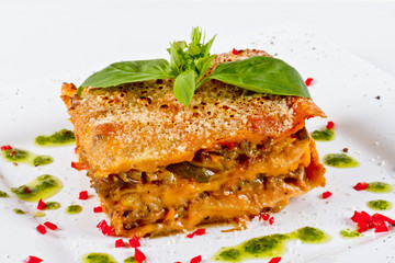 Closeup of lasagna and basil fork