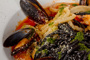 Black tagliatelle (pasta made with cuttlefish ink) with shrumps,