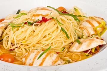 close-up of plate of pasta and chicken