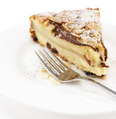 A piece of pear pie  on a white plate.