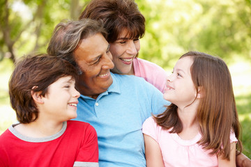Fototapeta premium Hispanic grandparents and grandchildren outdoors