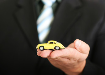 Sales agent offering a car