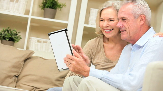 Retired Couple Using Wireless Tablet Technology