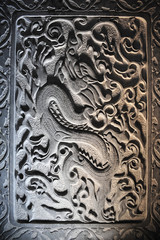 Dragon stone sculpture on wall, China
