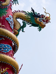 Fototapeta na wymiar Dragon statue on post in Buddhist temple