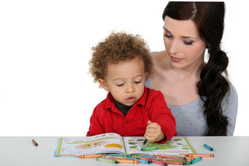 Mother and son coloring-in together