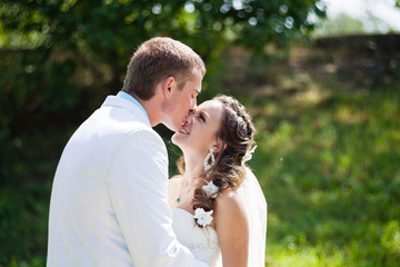 Bride and groom kissing