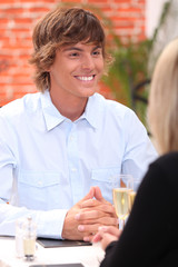 Smiling young man in a restaurant