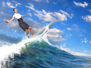 Businesswoman surfing on the sea waves