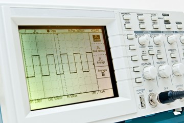 Digital oscilloscope with square wave on the screen