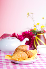 continental colorful  breakfast on a pink background