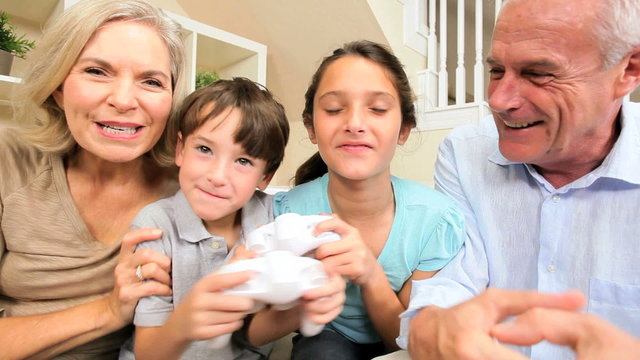 Grandchildren Competing on Games Console