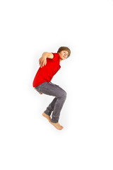 Portrait Of Teenage Boy Jumping In The Air