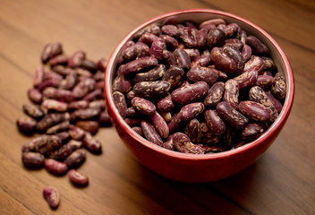beans in a bowl on a wooden table