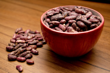 beans in a bowl on a wooden table