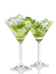 glasses of cocktail with lime and mint isolated on white