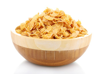 tasty cornflakes in wooden bowl isolated on white