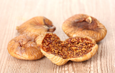 delicious dried figs on wooden background