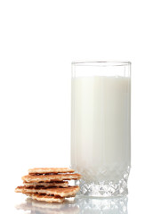 glass of milk and cookies isolated on white