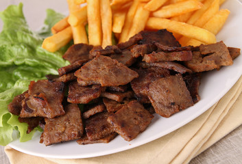 grilled meat and french fries