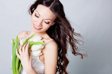 Beautiful brunette with orchid flowers