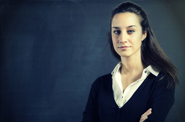 Portrait of a young woman, college student or teacher