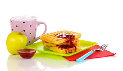 Tasty waffles with jam on plate isolated on white