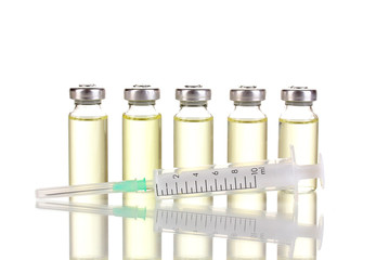 Syringe and medical ampoules isolated on white