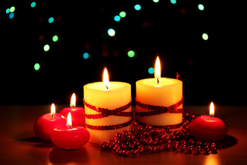 Beautiful candles and decor on wooden table on bright background