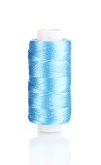 Blue bobbin thread isolated on white
