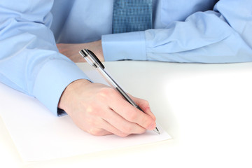 Businessman writing on document