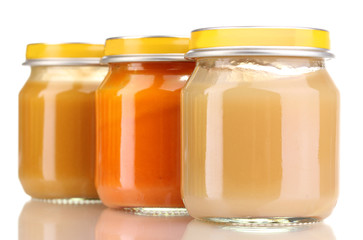 Jars of baby puree isolated on white
