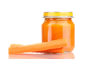 Jar of baby puree with carrot isolated on white