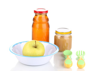 Jar of baby puree and juice with plate, spoon and fork isolated