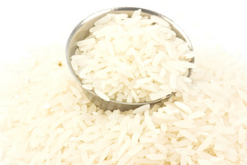 Uncooked rice in a metal bowl