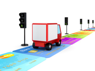 Red truck on a road made of colorful credit cards.