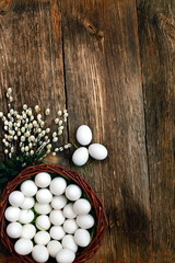 Easter eggs and  natural wooden country table